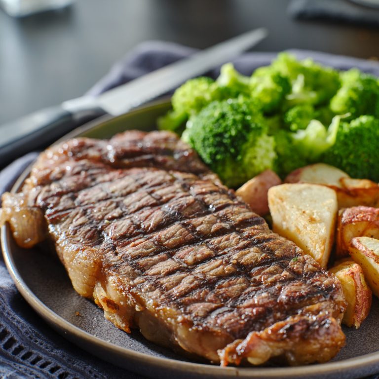 grilled new york steak with broccoli and roasted potatoes