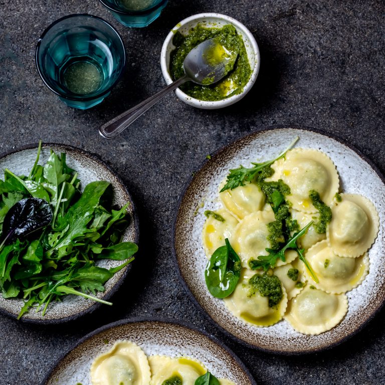 Italian spinach ricotta ravioli, Top view, black background, copy space, Vegetarian food, vegan ravioli.