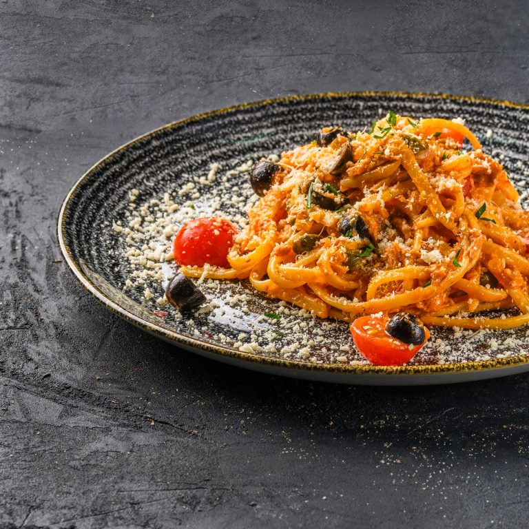 Pasta with tomato, parmesan cheece and olives